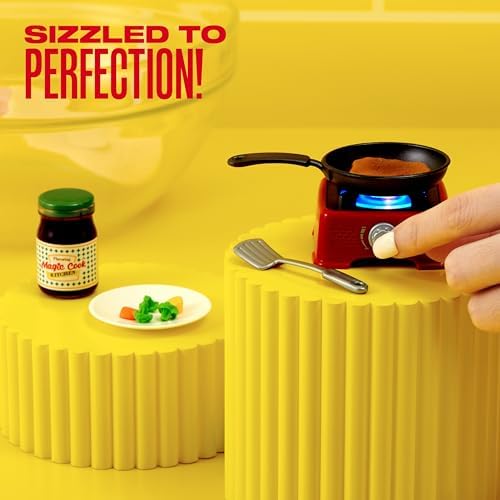 ZURU Mini Brands Magic Cook Kitchen open capsule revealing pink miniature waffle maker toy