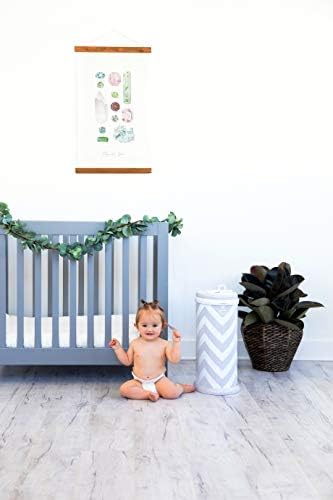 Ubbi steel odor locking bin in nursery lifestyle setting