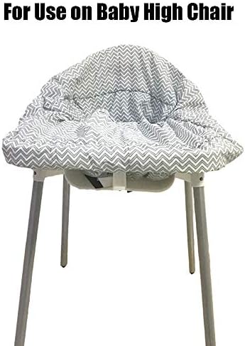 Infant sitting securely inside the Brain Architect Child gray chevron trolley cover