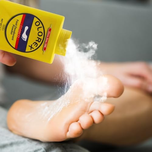 Reusable black charcoal deodorizer pouches placed inside athletic running shoes.