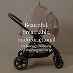 Mother using Solly Baby cover for discreet breastfeeding