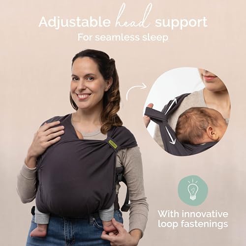 Parent using the hands free Boba Bliss baby carrier indoors