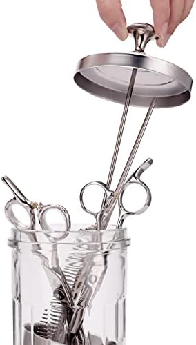 Iebarber sterilizer jar containing barber hair styling tools