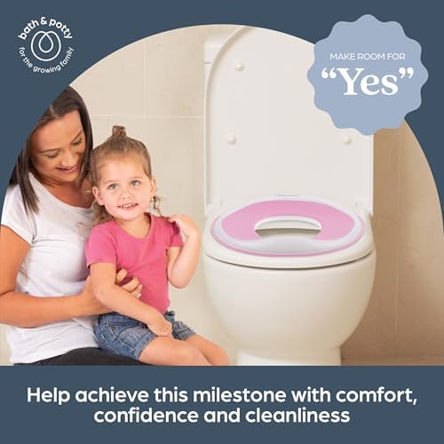 Dreambaby lightweight toddler toilet seat cover being wiped clean with a disinfectant cloth
