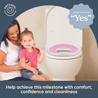 Dreambaby lightweight toddler toilet seat cover being wiped clean with a disinfectant cloth