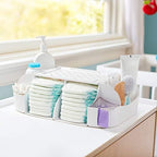 Munchkin Diaper Duty Organizer with diapers in the main compartment