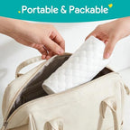 Changing pad liner placed securely on a standard nursery changing table
