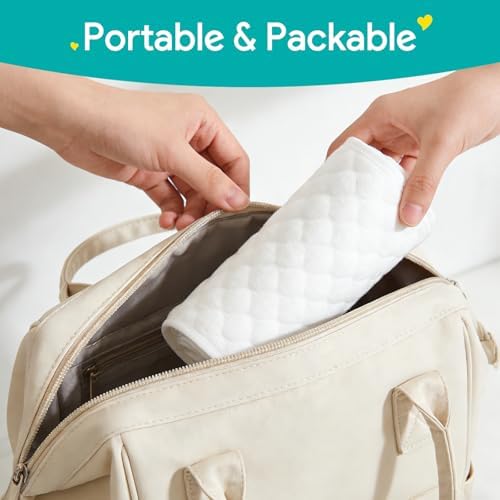 Changing pad liner placed securely on a standard nursery changing table