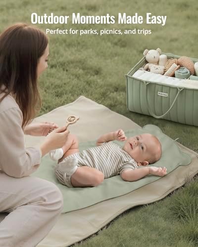Wipeable vegan leather travel changing pad being cleaned easily with a damp wipe.