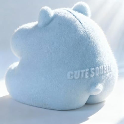 Top angle view of the blue flocked realistic hamster toy on a clean desk background.