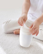 Duri child pee bottle being held for size reference