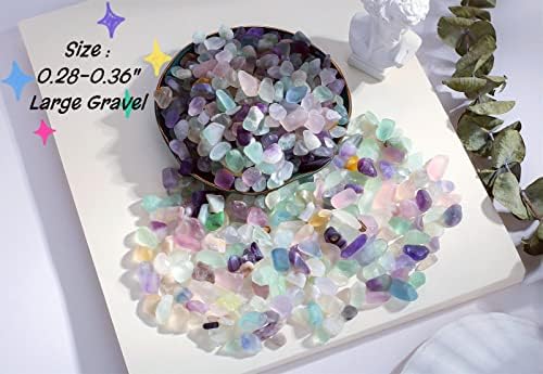 Polished fluorite aquarium gravel displayed next to a measuring scale.