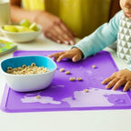 The textured non slip bottom surface of the Munchkin toddler placemat adhering to a table.