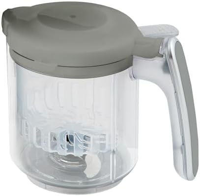 Gray steaming basket insert placed next to the transparent baby food blender jar