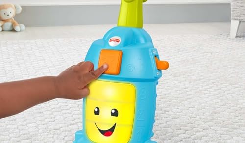 Authentic Fisher-Price learning toy vacuum in use with bright lights illuminating the front panel.
