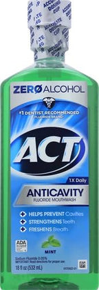 ACT alcohol free oral rinse mint flavor showing the built-in precision dosing cup