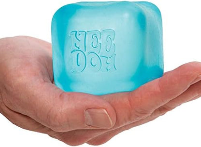 Close up view of the square shape retention feature of a pink Schylling stress relief cube.