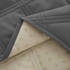 Grey Ameritex dog bed blanket folded neatly to highlight its lightweight texture.