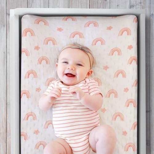 The Peanutshell baby changing table sheet showing floral and rainbow pattern details