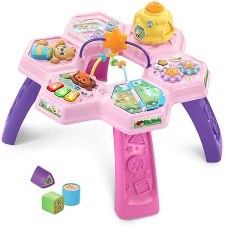 Close-up of the pink VTech activity center showcasing the beehive shape sorter and pop-up fox mechanism.