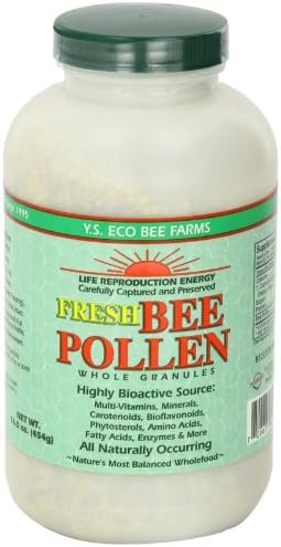 Whole bee pollen granules poured out of container