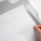 Close-up of embossed waffle pattern on absorbent tissue paper