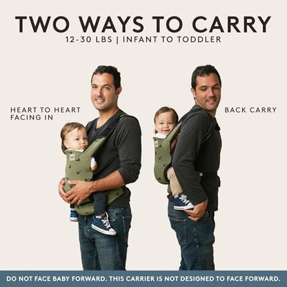 Parent wearing Tula Lite carrier with baby in inward facing position.