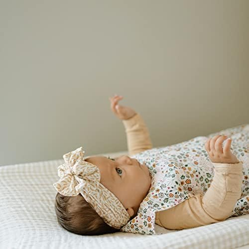 The authentic USA imported infant changing pad cover spread flat on a modern nursery table.