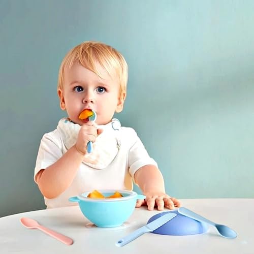 Toddler using ergonomic macaron colored fork