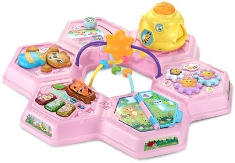 Side perspective of the VTech two-in-one play table configured low to the ground for infant floor play.