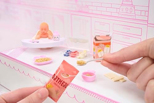 Unboxed MGA's Miniverse surprise baby collection layout featuring two completed doll sets.