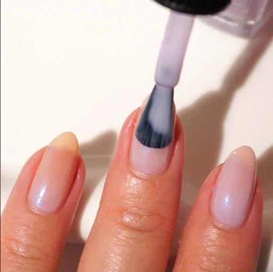 Sheer lavender nail polish bottle on a clean background highlighting the twenty-one free formula.