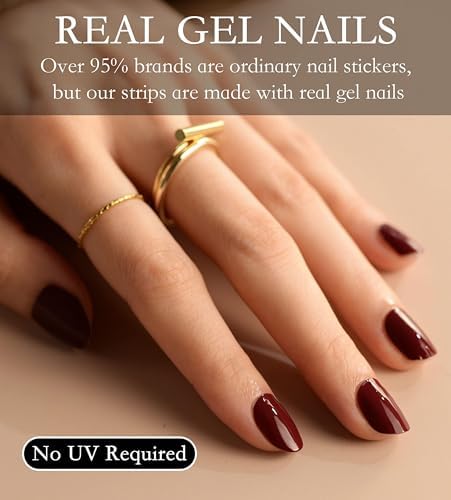 Trimming excess length of the vineyard dark red gel wrap using the included prep nail file