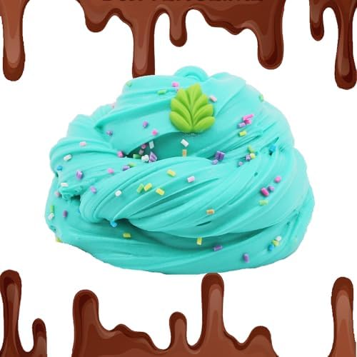Close up view of miniature fruit and sweet treats charms embedded in soft slime.