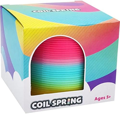 Vibrant three inch plastic magic spring cascading between hands for dexterity play