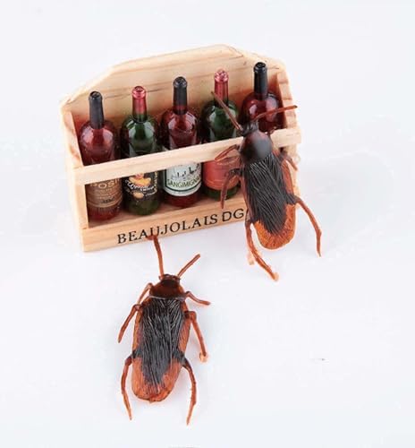 Five realistic plastic bugs from Ksquares arranged on a plain surface