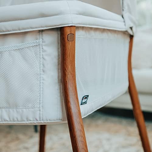 Close up view of the zip off machine washable fabrics on the infant bassinet