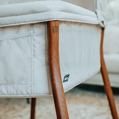 Close up view of the zip off machine washable fabrics on the infant bassinet