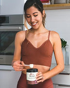Terra Origin Healthy Gut Powder lifestyle mixing in water glass