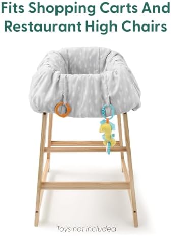 Adjustable safety strap and toy loops on the neutral grey toddler cart cover