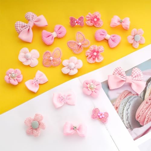 Assorted styles of small puppy hair bows with rubber bands