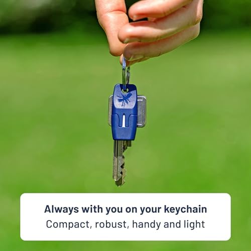 Compact electronic insect sting healer displaying its small travel size next to keys