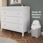 Foundations mini diaper pail placed inside a modern nursery