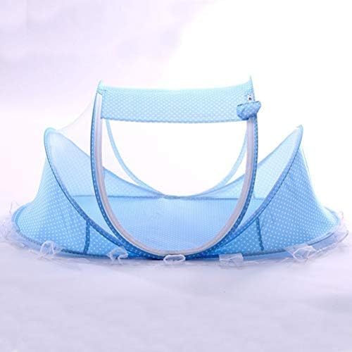 Keenso travel baby bed showcasing blue and white polka dot pattern detailing