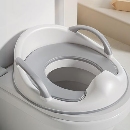PandaEar lightweight toddler toilet ring being held by the convenient top loop