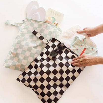 Tiny Twinkle wet bags showing the convenient snap-closure strap handle