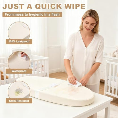 Qalvyn contoured changing pad showing the adjustable non slip safety belt feature