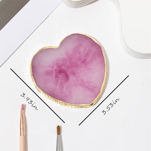 Close up of heart shaped nail design display board with gold trim