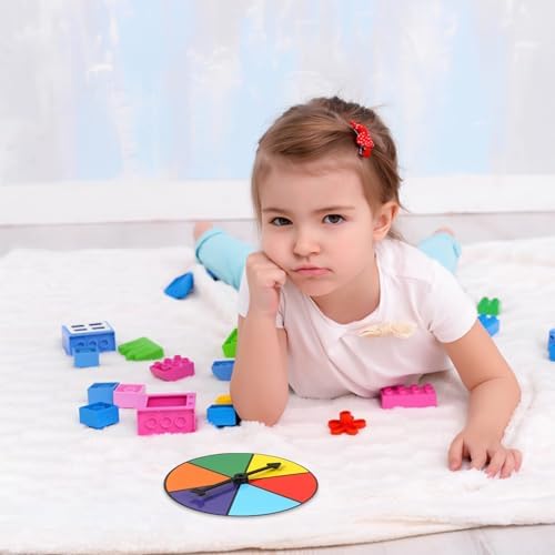 Teacher using Midelong color spinners for classroom probability demonstration.
