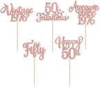 Group of elegant rose gold 50th birthday party supplies